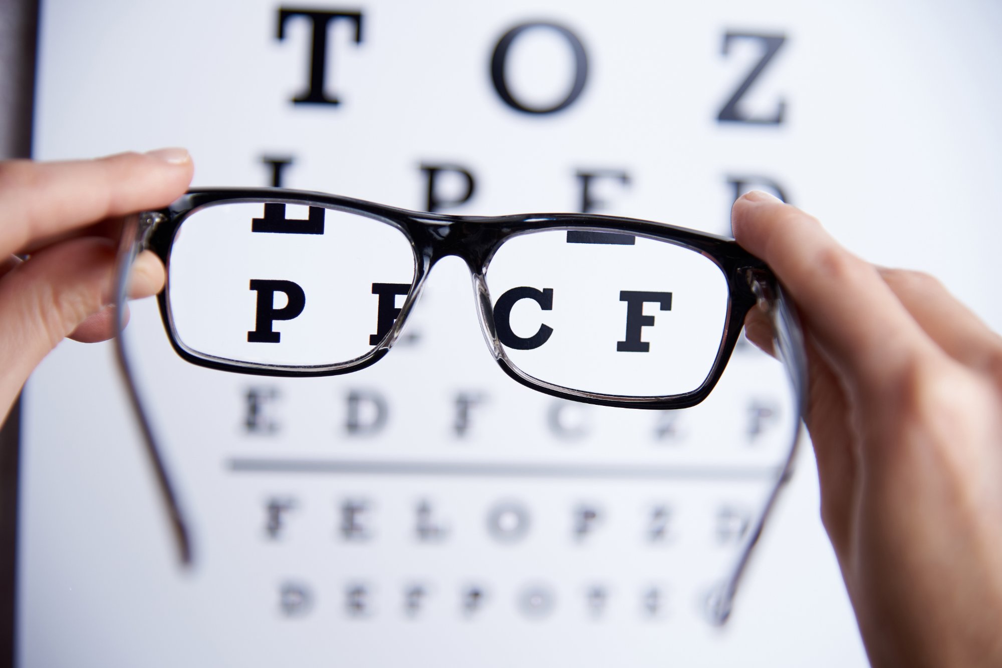 Optometrist helping a patient choose eyeglass frames